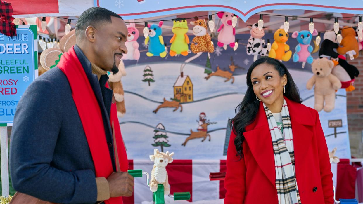  Ronnie Rowe, Mishael Morgan at a holiday carnival in Christmas with a Kiss. 