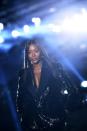 Naomi Campbell closed the Saint Laurent show with a glistening patent smoking