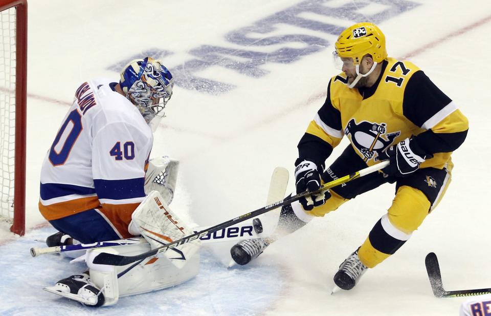 Penguins right wing Bryan Rust is stopped by Islanders goalie Semyon Varlamov during the second period of Game 2.