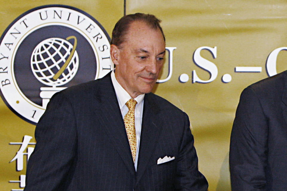 FILE - In this May 17, 2008, file photo, Bryant University President Ronald K. Machtley stands during a ceremony in Smithfield, R.I. An annual study released Tuesday, Jan. 14, 2020, by The Chronicle of Higher Education, finds that average pay for private university chiefs grew by 10.5% in 2017. Machtley's earnings were listed at $6.28 million. (AP Photo/Bizuayehu Tesfaye, File)