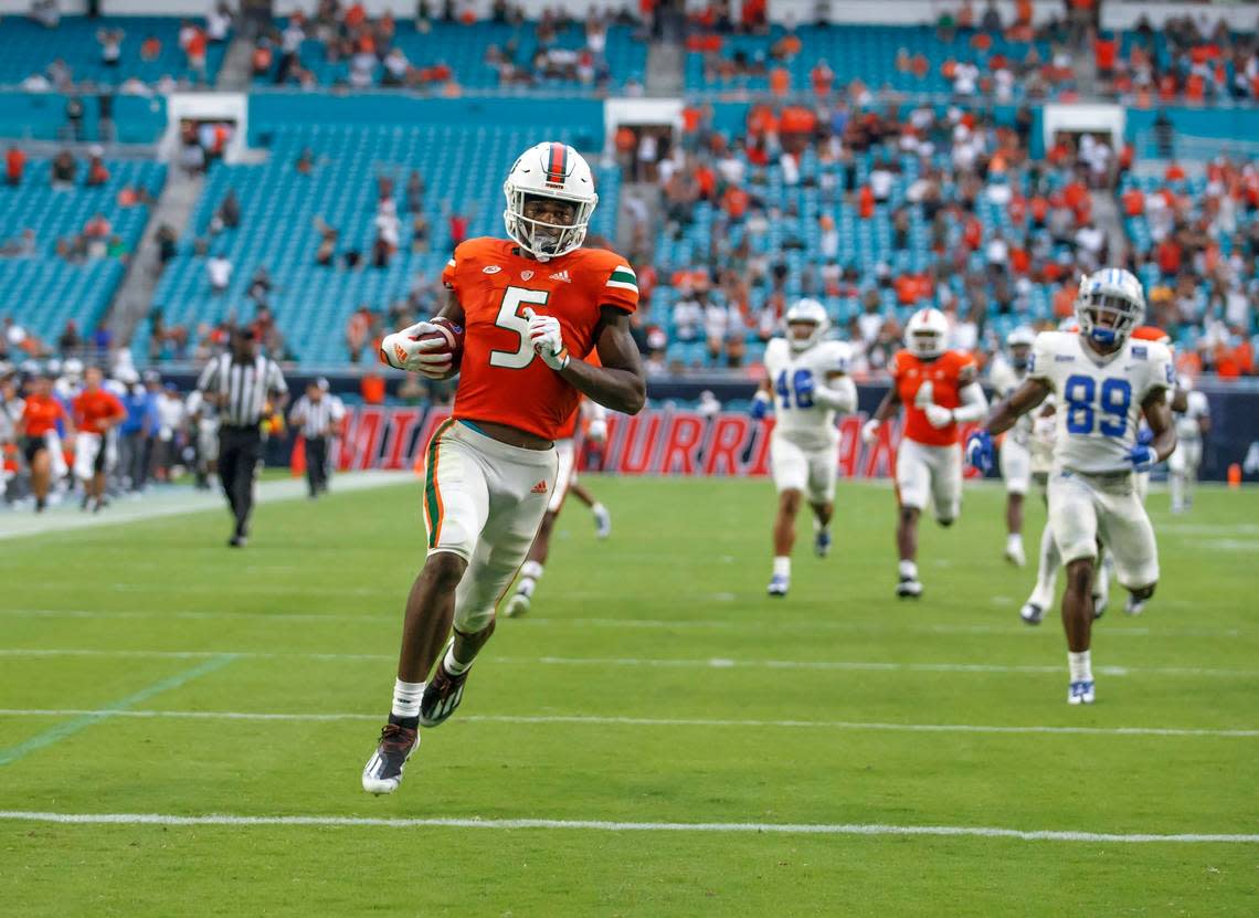 Miami Hurricanes wide receiver Key’Shawn Smith (5) scores a touchdown after returning a punt during the fourth quarter of an NCAA non conference game against Middle Tennessee State Blue Raiders at Hard Rock Stadium on Saturday, September 24, 2022 in Miami Gardens, Florida.