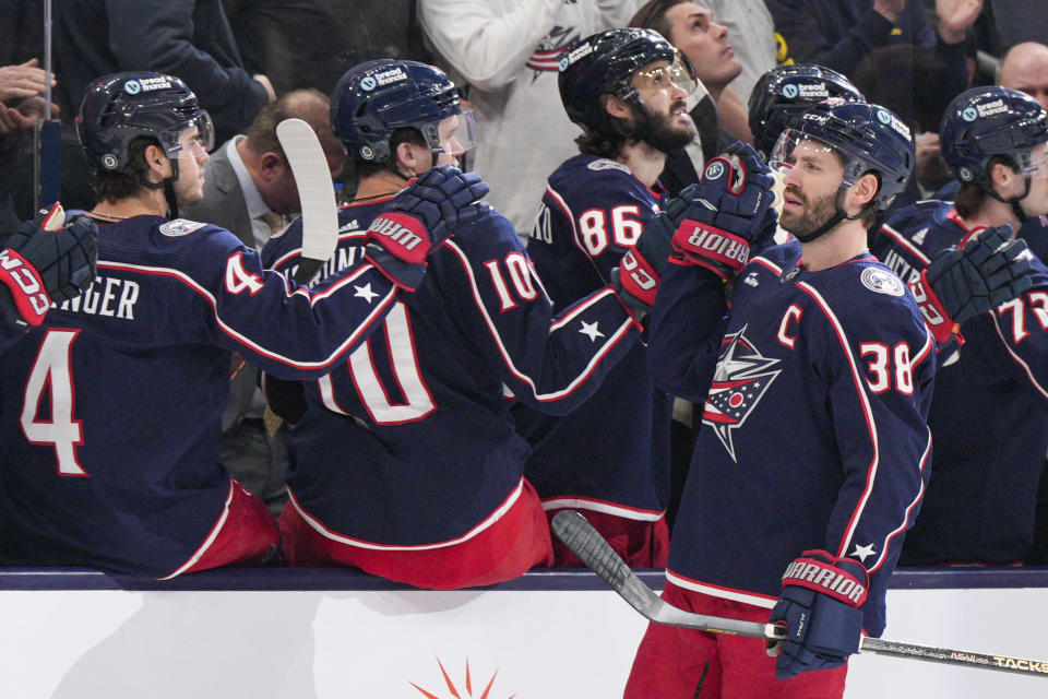 Columbus Blue Jackets' Boone Jenner (38) celebrates with teammates after scoring during the first period of an NHL hockey game against the Ottawa Senators Thursday, March 14, 2024, in Columbus, Ohio. (AP Photo/Jeff Dean)