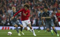 <p>Manchester United’s Marouane Fellaini, centre, holds off the challenge of Celta’s Daniel Wass </p>