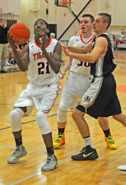Taunton's EJ Dambreville goes for a layup during a Hockomock League game against Foxboro on Dec. 22, 2014. (File photo)