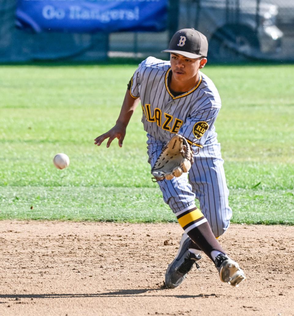 Golden West's Moses Magallanes fields a hit ball against Redwood in a West Yosemite League high school baseball game Tuesday, April 19, 2022. 