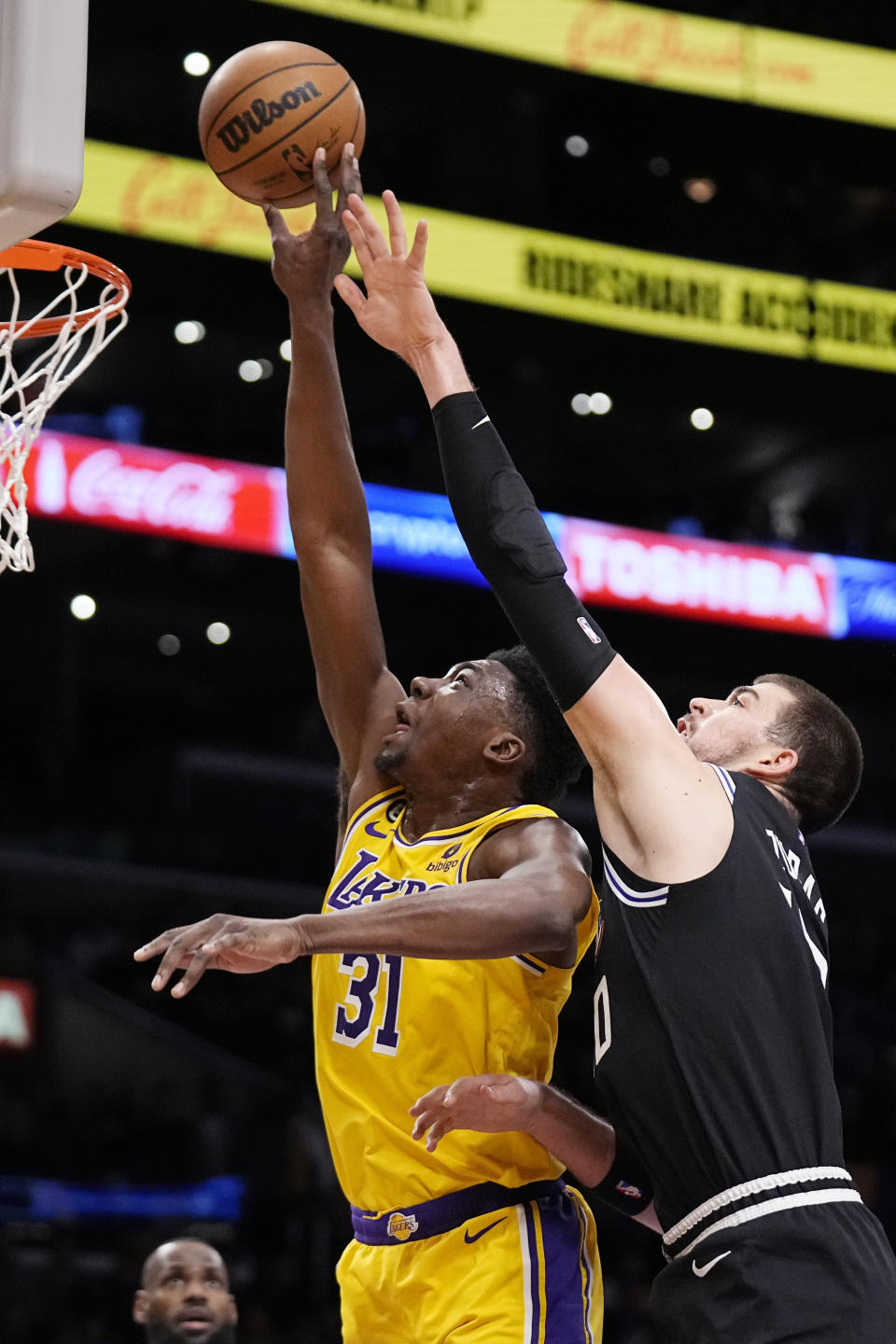 Los Angeles Lakers center Thomas Bryant, left, and Los Angeles Clippers center Ivica Zubac go after a rebound during the first half of an NBA basketball game Tuesday, Jan. 24, 2023, in Los Angeles. (AP Photo/Mark J. Terrill)