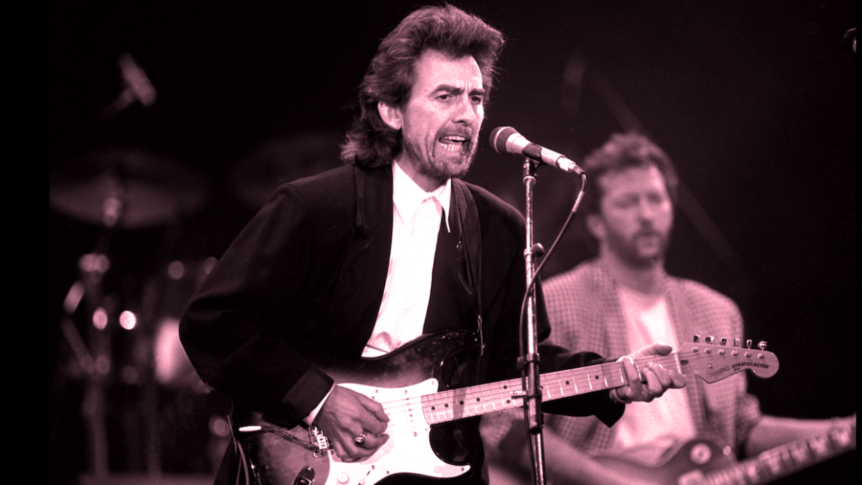  George Harrison performs with Eric Clapton during a concert for the Princes Trust, at Wembley Stadium, London, circa 1987 . 