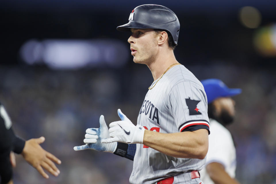 Minnesota Twins' Max Kepler gestures after his RBI single against the Toronto Blue Jays during the ninth inning of a baseball game Friday, May 10, 2024, in Toronto. (Cole Burtson/The Canadian Press via AP)