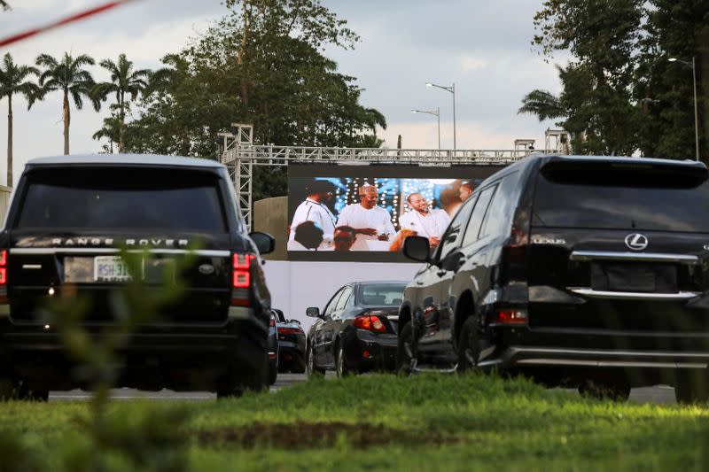 Movie audiences sit in their parked cars as they watch "Living in bondage" at a drive-in cinema, following the relaxation of lockdown, amid the coronavirus disease (COVID-19) outbreak in Abuja
