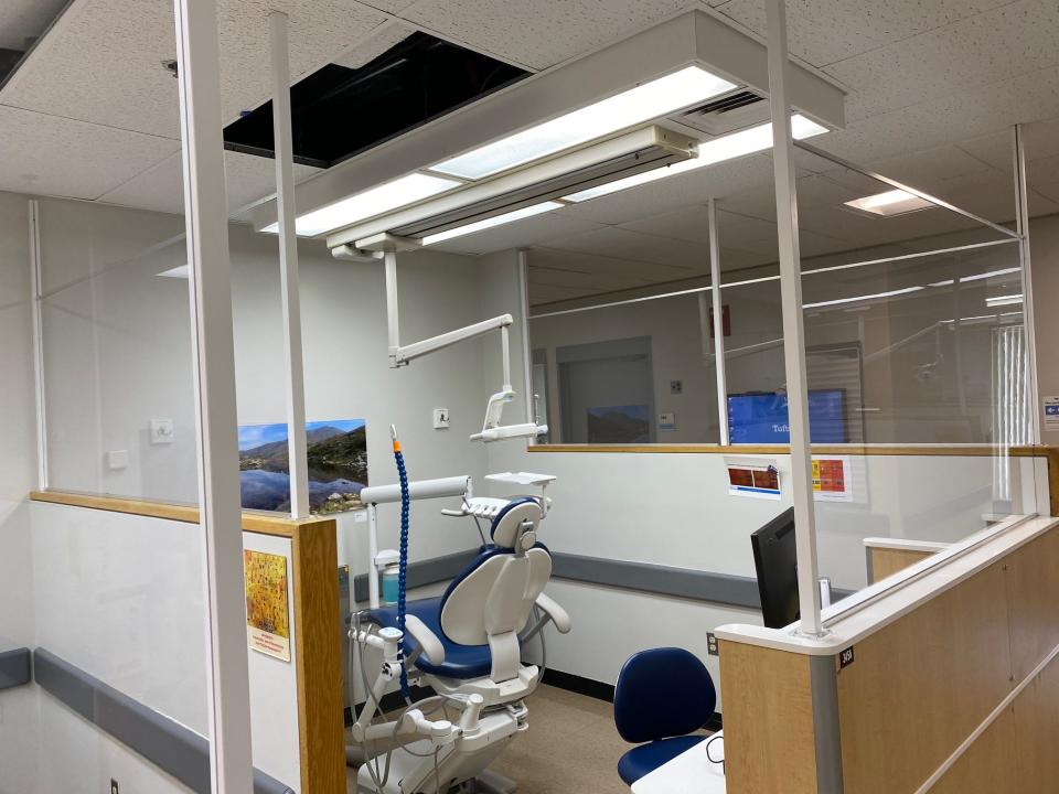 Plexiglass barriers at dental clinics at Tufts have been combined with HVAC changes, PPE requirements, strict limits on the number of patients, and other measures to increase patient safety.