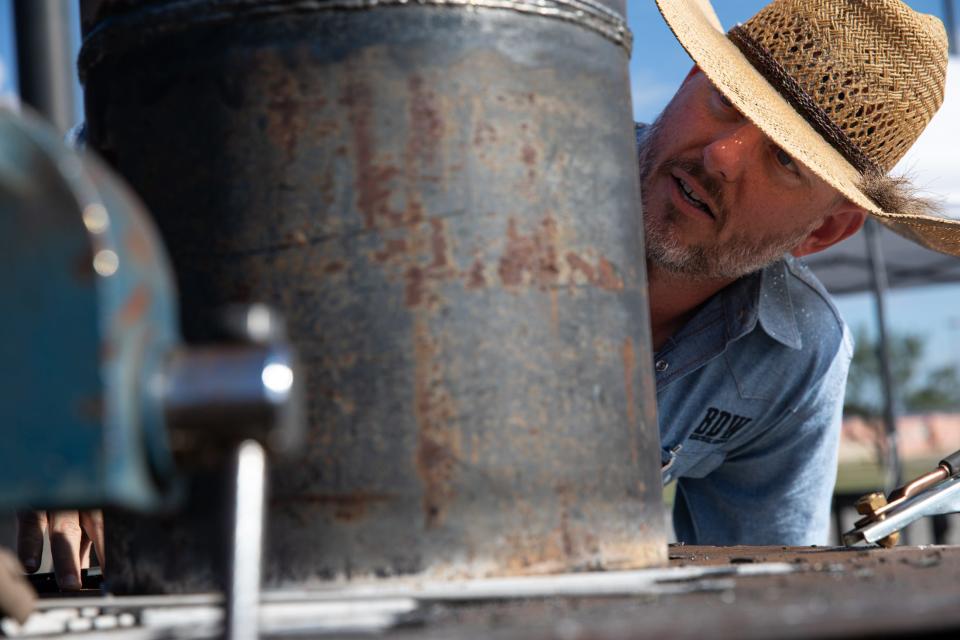 Matt Richard, of Blue Diamond Welding, judges a partner weld during a competition at Del Mar College on Friday, Nov. 3, 2023.