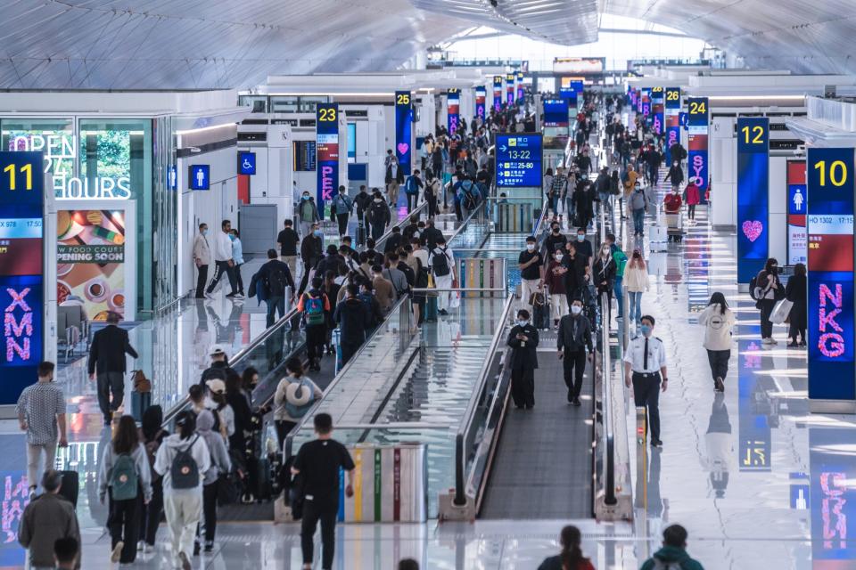 Travelers at the Hong Kong airport on Feb. 17.