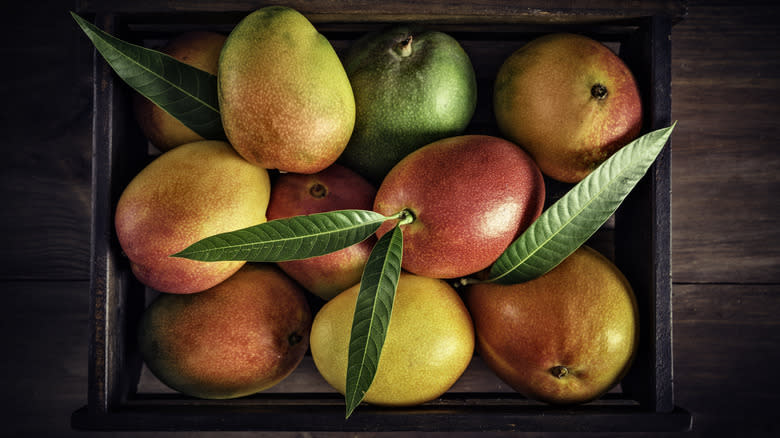 Wooden box of mangoes