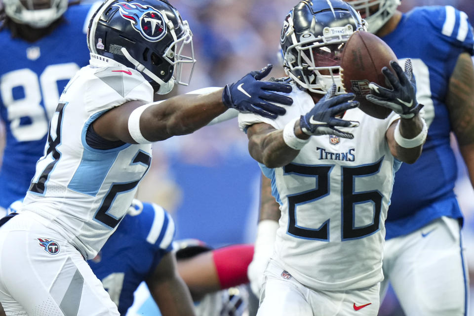 Tennessee Titans cornerback Kristian Fulton recovers a fumble in front of teammate Joshua Kalu in the second half of an NFL football game against the Indianapolis Colts in Indianapolis, Fla., Sunday, Oct. 2, 2022. (AP Photo/AJ Mast)