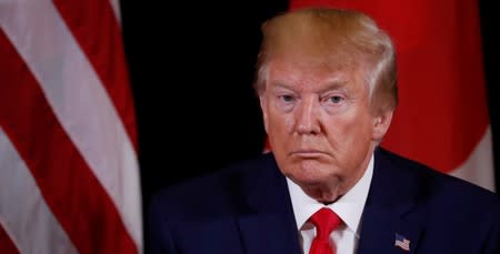 U.S. President Trump listens to reporters questions during meeting with Japan's Prime Minister Abe meets in New York City