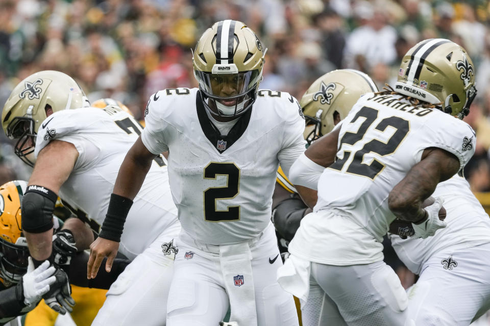 New Orleans Saints quarterback Jameis Winston (2) hands off to wide receiver Rashid Shaheed (22) during the second half of an NFL football game against the Green Bay Packers Sunday, Sept. 24, 2023, in Green Bay, Wis. (AP Photo/Morry Gash)