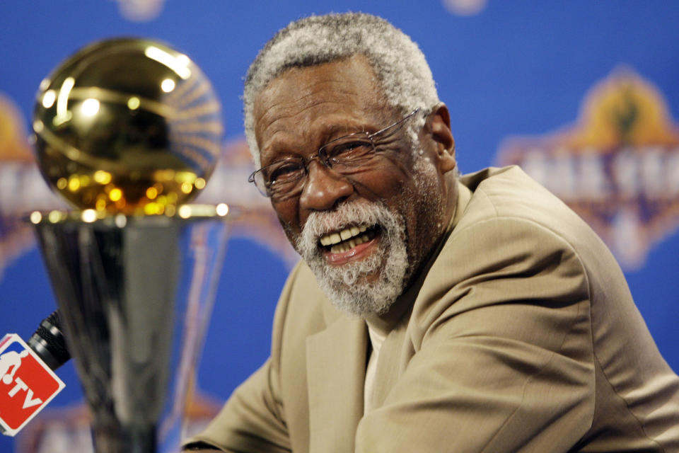 FILE - NBA great Bill Russell reacts at a as he learns the most valuable player award for the NBA basketball championships has been renamed the Bill Russell NBA Finals Most Valuable Player Award during a news conference Feb. 14, 2009 in Phoenix. Basketball fans hoping to buy something from Bill Russell’s memorabilia collection should expect some big-name competition. Hall of Famers Shaquille O’Neal and Charles Barkley say they're interested in bidding on items that Russell — a civil rights icon and the most decorated champion in team sports history — is selling off. An online auction with 429 lots began last week and will culminate in a live event at the TD Garden on Friday, Dec. 10, 2021 (AP Photo/Matt York, File)