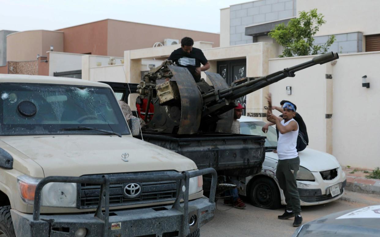 Members of the Libyan internationally recognised government forces are seen during fighting with Eastern forces in Ain Zara - REUTERS