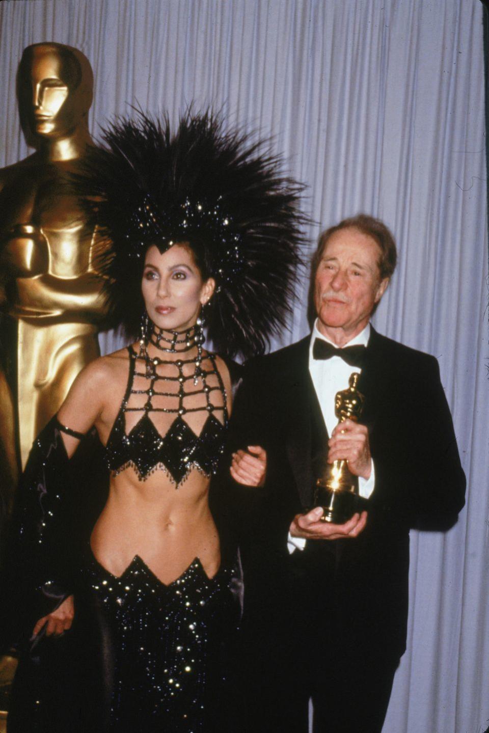 1986: Cher wears a crazy feathered outfit.