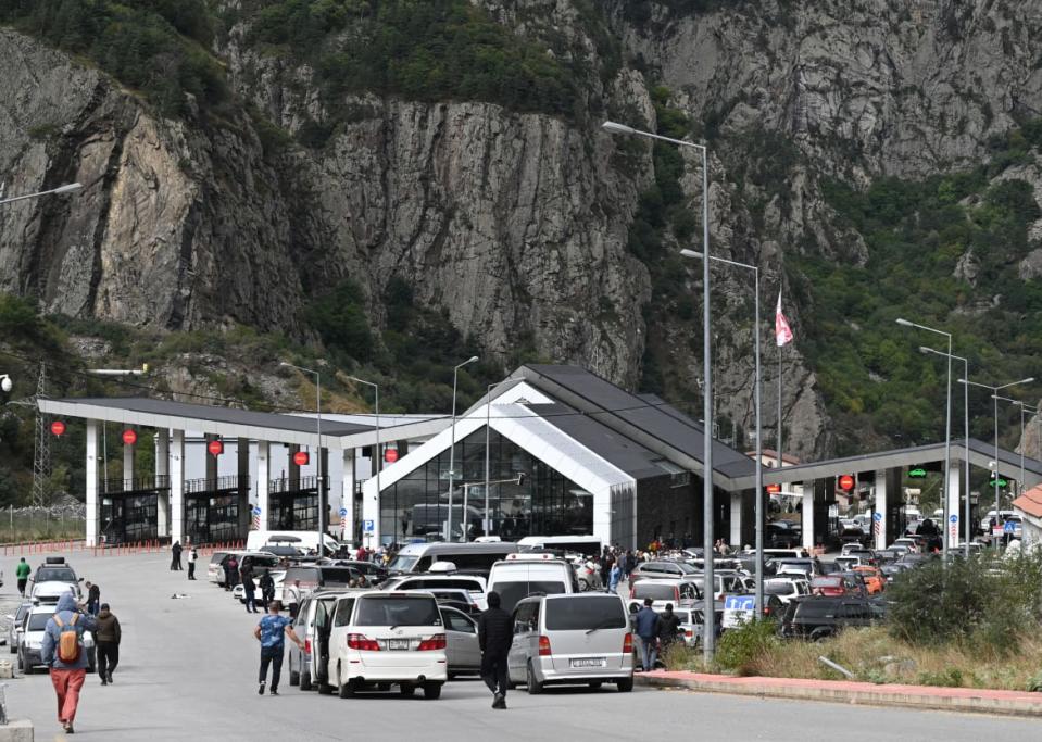 <div class="inline-image__caption"><p>People arriving from Russia wait at the Mongolian border checkpoint of Altanbulag on September 25, 2022, after the Kremlin announced a partial mobilization for the war in Ukraine.</p></div> <div class="inline-image__credit">BYAMBASUREN BYAMBA-OCHIR/AFP via Getty</div>