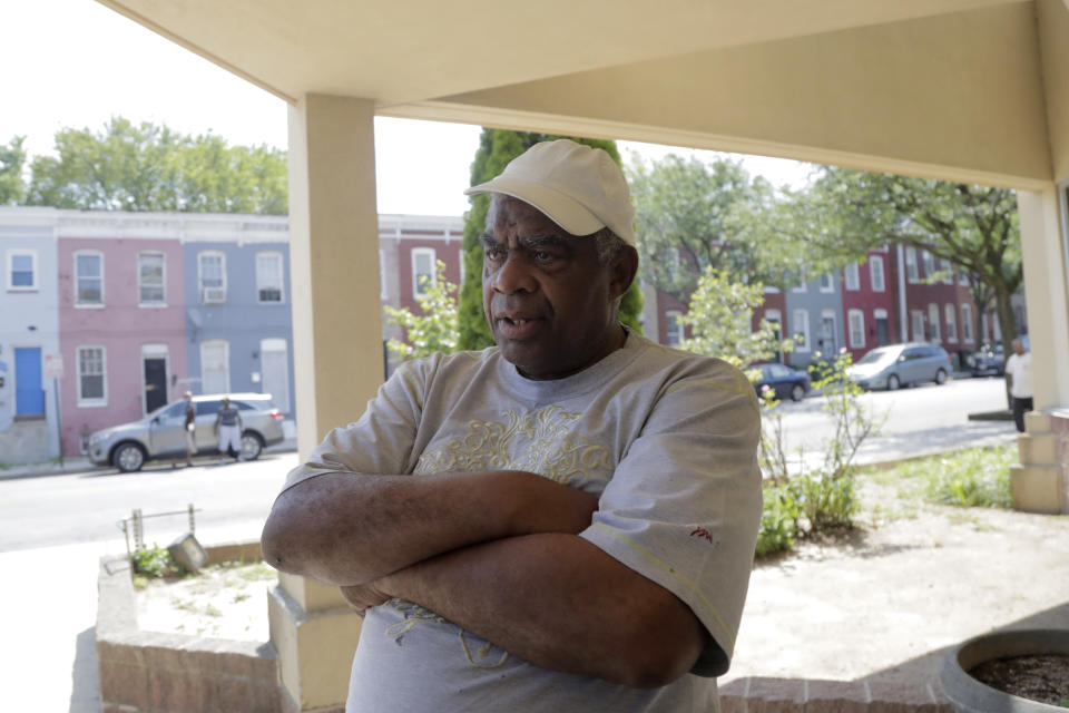 Roosevelt Jenkins, 73, talks to The Associated Press during an interview outside the Sandtown-Winchester Senior Center, Monday, July 29, 2019, in the Sandtown section of Baltimore. Jenkins said he was not happy with President Donald Trump's twitter comments over the weekend. In the latest rhetorical shot at lawmakers of color, President Donald Trump vilified Rep. Elijah Cummings' majority-black Baltimore district as a "disgusting, rat and rodent infested mess" where "no human being would want to live." (AP Photo/Julio Cortez)