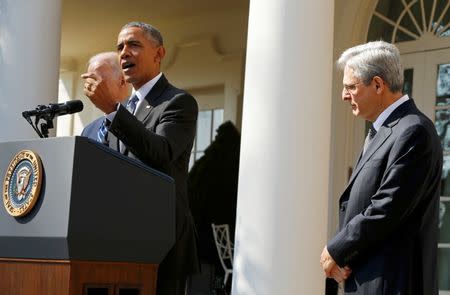 U.S. President Barack Obama (C) announces Judge Merrick Garland (R) as his nominee to the U.S. Supreme Court, as Vice-President Joe Biden (L) accompanies them in the Rose Garden of the White House in Washington D.C., March 16, 2016. REUTERS/Jonathan Ernst