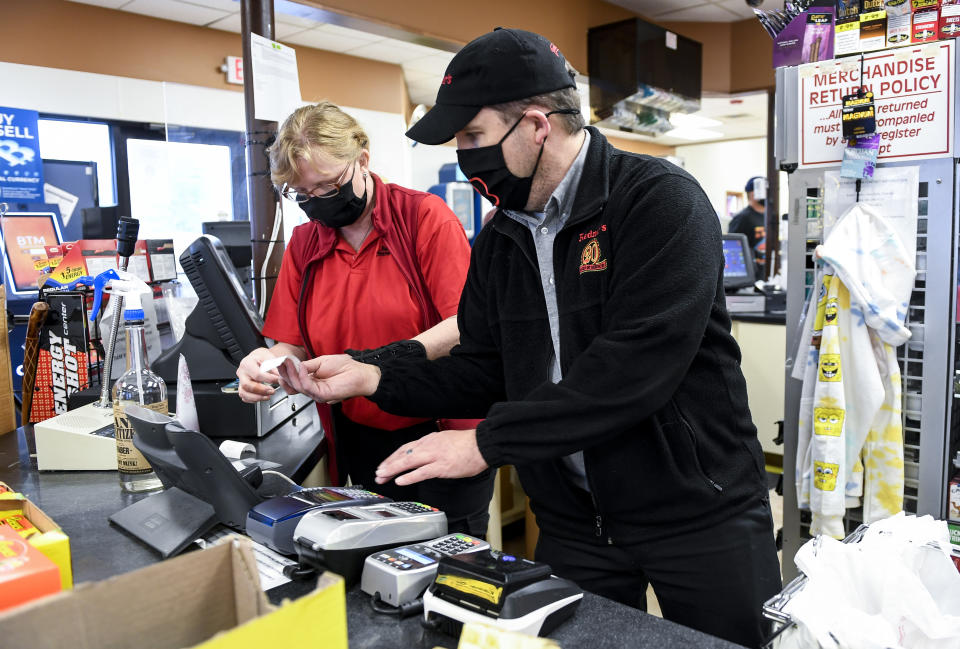 Muhlenberg, PA - March 18: Redner's Quick Shoppe employee Julie Zezenski and  Manager Pete Ostrowski work behind the counter at the Redner's Quick Shoppe on Tuckerton Road in Muhlenberg township Thursday afternoon March 18, 2021. (Photo by Ben Hasty/MediaNews Group/Reading Eagle via Getty Images)