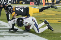 Baltimore Ravens wide receiver Sammy Watkins (14) falls into the end zone after making a touchdown catch as Pittsburgh Steelers cornerback Tre Norwood (21) defends during the second half of an NFL football game, Sunday, Dec. 5, 2021, in Pittsburgh. The Steelers won 20-19. (AP Photo/Gene J. Puskar)