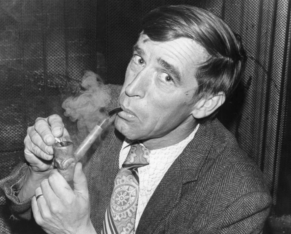 Dr David Etnier, in an undated photo, smoking a hand-carved pipe.