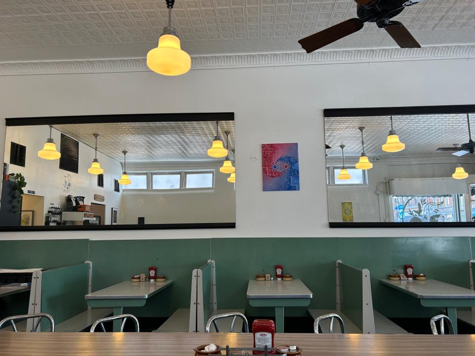 The retro green booths at TUSK diner in Barberton, which remain from the former Al's Corner Restaurant, came from the old Lake Restaurant that was down the street.