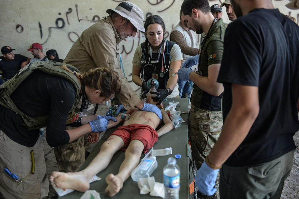 <p>An Iraqi boy, who suffered injuries following a suicide attack as he was escaping the Old City of Mosul, receives treatment at a field hospital on June 23, 2017. (Photo: Mohamed el-Shahed/AFP/Getty Images) </p>