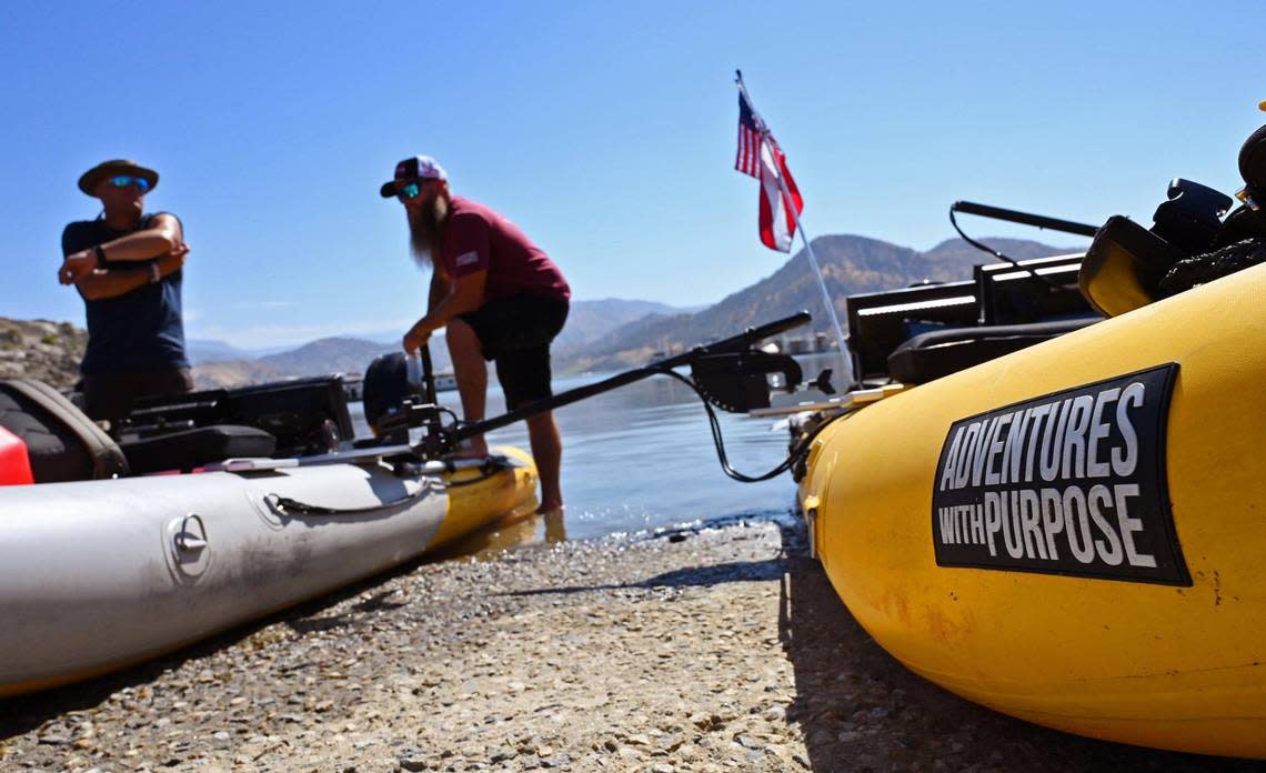 Adventures With Purpose lead diver Nick “Rattlesnake” Rinn, left, and team leader Doug Bishop, right, prepare to launch to begin their search for Jolissa Fuentes at Pine Flat Lake’s Deer Creek marina Friday morning, Aug. 26, 2022 in Fresno. The team search Avocado Lake on Thursday. ERIC PAUL ZAMORA/ezamora@fresnobee.com