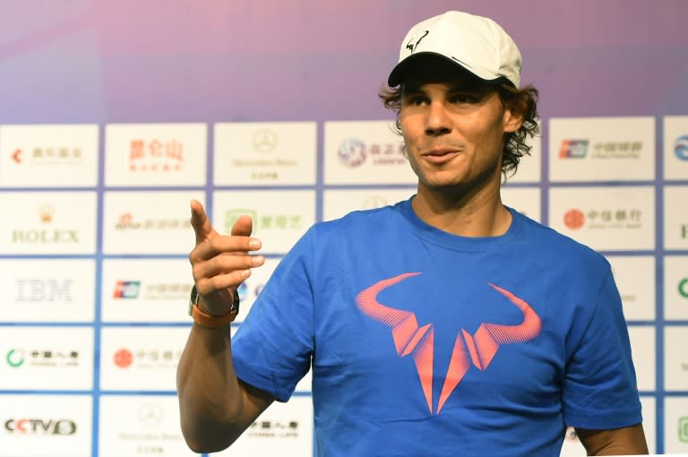 Rafael Nadal of Spain gestures as he talks to a journalist after a press conference at the China Open tennis tournament in Beijing on October 4, 2015