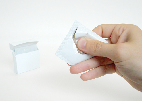 One-handed condom wrapper