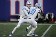 Detroit Lions quarterback Jared Goff (16) hands off the ball to running back Jamaal Williams (30) during the second half of an NFL football game against the New York Giants, Sunday, Nov. 20, 2022, in East Rutherford, N.J. (AP Photo/Seth Wenig)