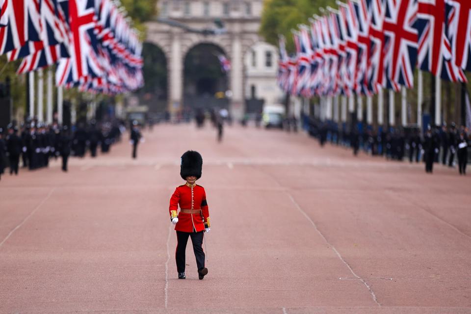 A Royal Guard marches along The Mall ahead of the state funeral of Queen Elizabeth II, in London, UK, on Monday, Sept. 19, 2022. The Queen's life is commemorated at her state funeral in Westminster Abbey in London, to be attended by roughly 500 global dignitaries and world leaders including US President Joe Biden.