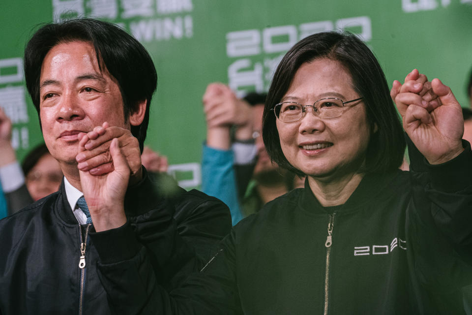 TAIPEI, TAIWAN - JANUARY 11: Taiwan President Tsai Ing-wen (R) joins her hands with Vice President-elect William Lai (L) outside the campaign headquarters in Taipei and declared victory in Taiwan's election on January 11, 2020 in Taipei, Taiwan. (Photo by Clicks Images/Getty Images)