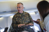 Joint Chiefs Chairman Gen. Joseph Dunford gestures while speaking to reporters during a briefing on a military aircraft before arrival at El Paso International airport, Saturday, Feb. 23, 2019. Dunford is traveling with Acting Secretary of Defense Patrick Shanahan and they are planning to pay a visit to Texas-Mexico border. (AP Photo/Pablo Martinez Monsivais, Pool)