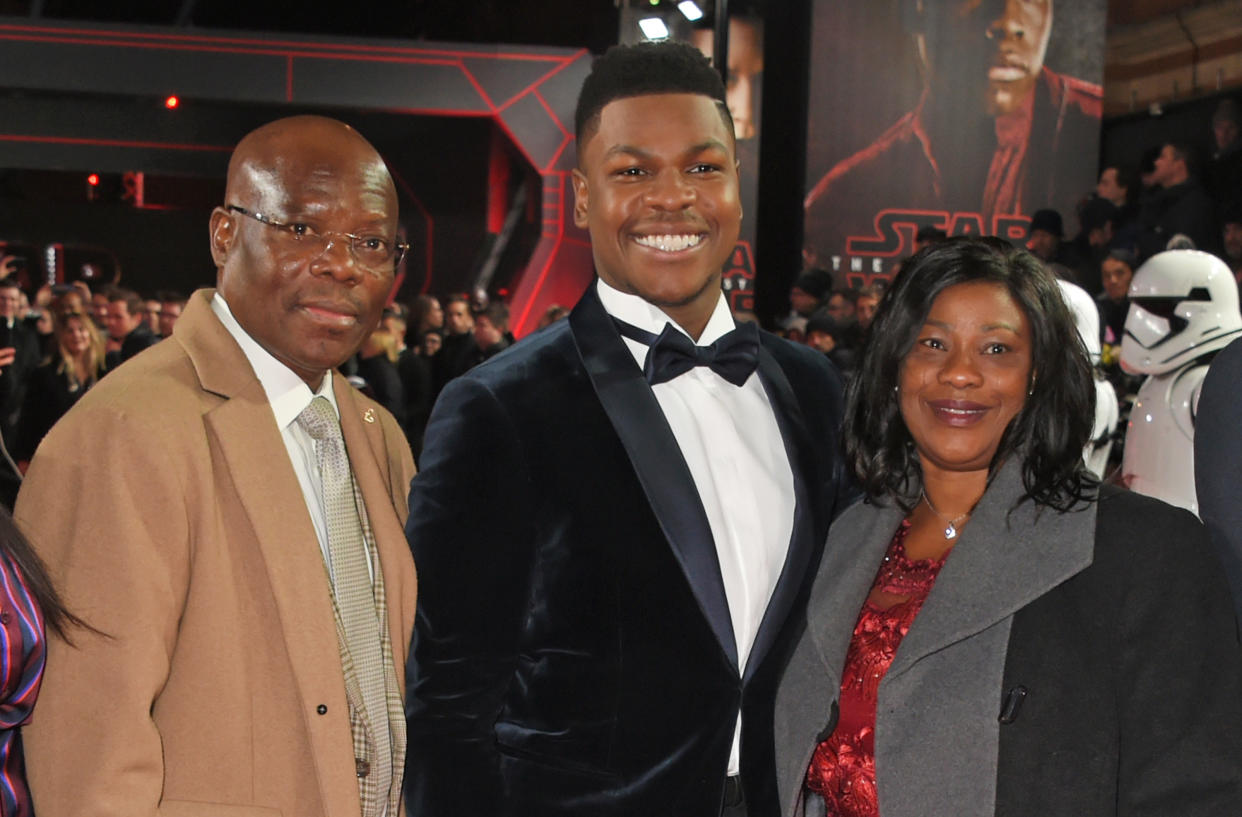 John Boyega (C) poses with parent Samson Boyega (L) and Abigail Boyega at the European Premiere of "Star Wars: The Last Jedi" at the Royal Albert Hall on December 12, 2017 in London, England.  (Photo by David M. Benett/Dave Benett/WireImage)