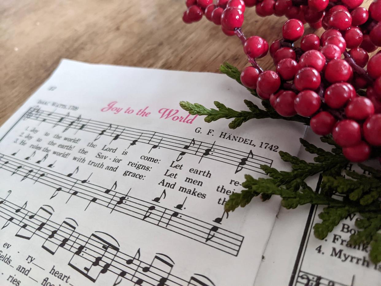 Abbey begrudgingly goes caroling — and enjoys it.