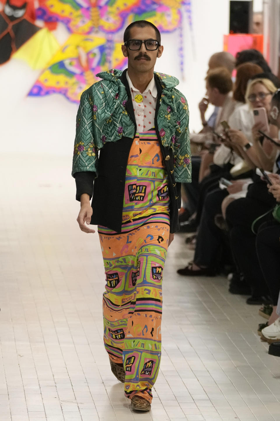 A model wears a creation as part of the Simon Cracker men's and women's Spring Summer 2024 collection presented in Milan, Italy, Sunday, June 18, 2023. (AP Photo/Luca Bruno)