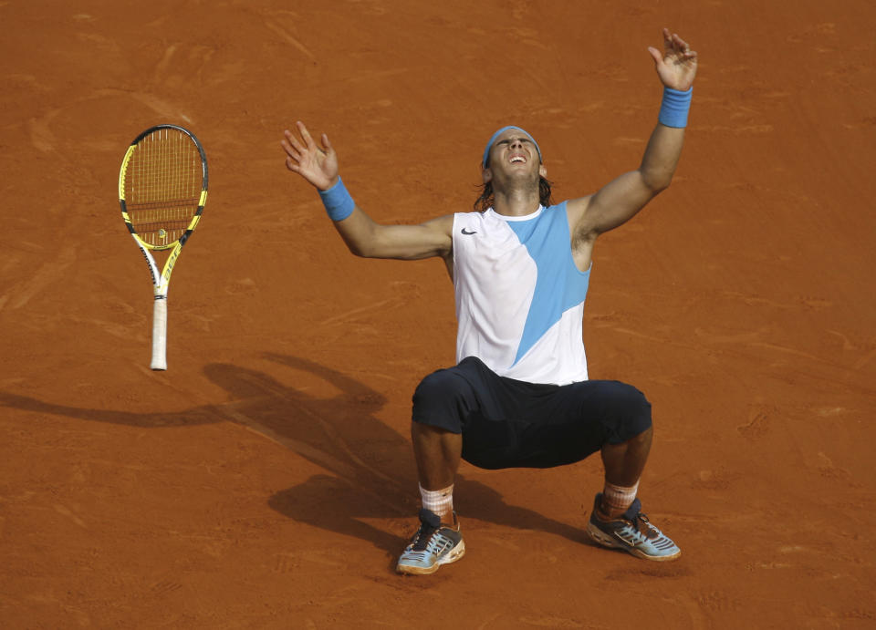 FILE - Spain's Rafael Nadal reacts as he defeats Switzerland's Roger Federer during the men's final match of the French Open tennis tournament at Roland Garros stadium in Paris, Sunday, June 10, 2007. Nadal won 6-3, 4-6, 6-3, 6-4. (AP Photo/David Vincent, File)