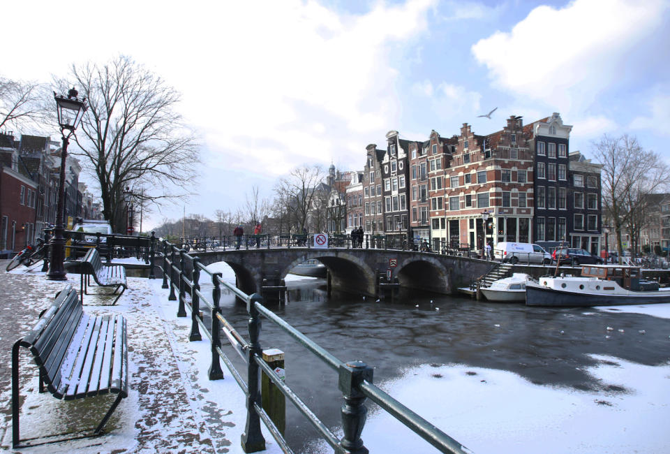 Tourists enjoying the view on the bridge at the Brouwersgracht frozen canal in Amsterdam, Netherlands. Photo: Paulo Amorim/Sipa USA