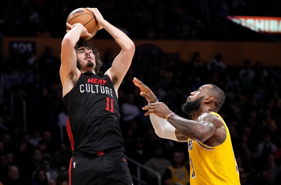 The Heat's Jaime Jaquez Jr. shoots — and scores — over LeBron James during Miami's 110-96 win over the Lakers in Los Angeles on Wednesday night. The Camarillo High graduate finished with 16 points on 7-of-14 shooting and also had eight assists.