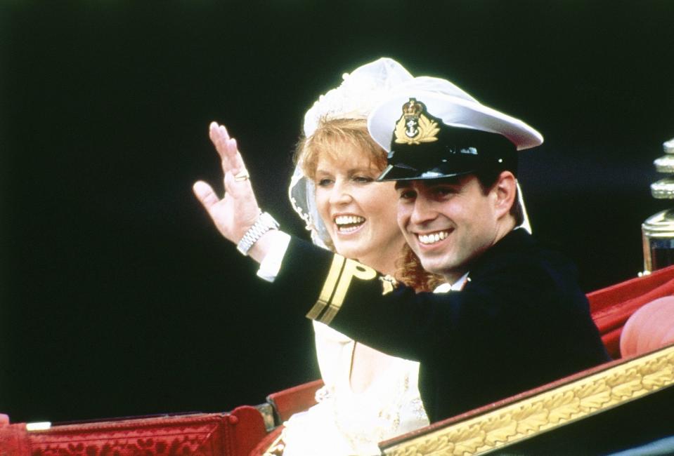 Prince Andrew the Duke of York and his bride Sarah Ferguson, Duchess of York, ride in the 1802 State Landau carriage in a ceremonial procession to London’s Buckingham Palace after their marriage at Westminster Abbey, July 23, 1986.