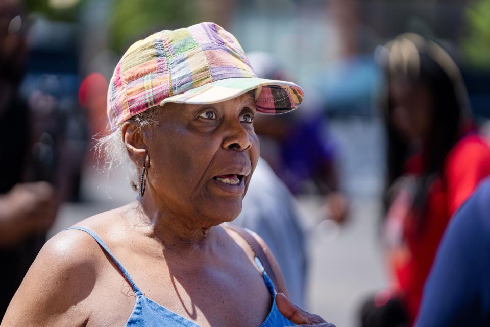 Johnnie Woods waits to hear news of her nephew Branden Colvin outside of his partially collapsed apartment building in Davenport Monday, May 29, 2023.