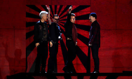 Irish group U2 receive an award at the 2017 MTV Europe Music Awards at Wembley Arena in London, Britain, November 12, 2017. REUTERS/Dylan Martinez