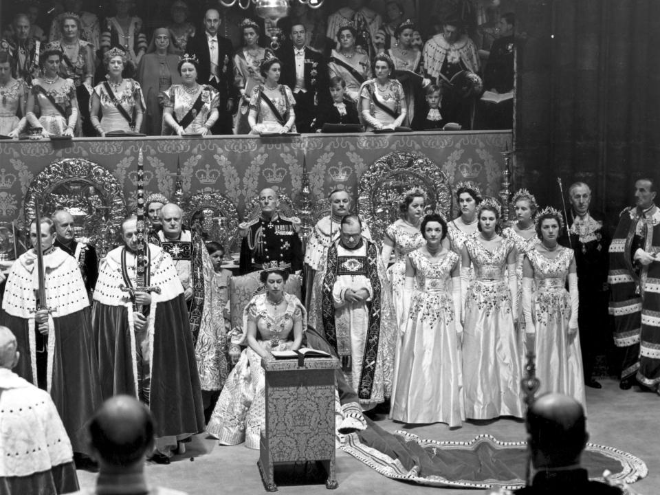 The Queen seated in the Chair of Estate.