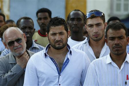 Syrian and Sub-Saharan African migrants attend a commemorative service, organised by the Jesuit Refugee Services for immigrants who lost their lives at sea earlier this month, at Valletta's Grand Harbour, October 25, 2013. REUTERS/Darrin Zammit Lupi