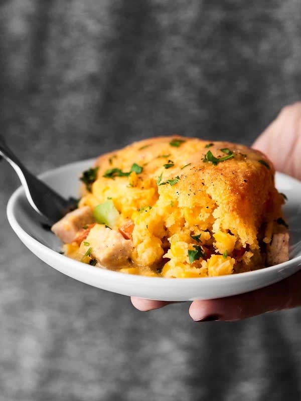 <p>Show Me the Yummy</p><p>This leftover turkey cornbread casserole is the perfect way to use up your Thanksgiving leftovers. Turkey and veggies are topped with flavorful gravy and baked with fluffy, golden-brown cornbread. </p><p><strong>Get the recipe: <a href="https://showmetheyummy.com/leftover-turkey-cornbread-casserole-recipe/" rel="nofollow noopener" target="_blank" data-ylk="slk:Leftover Turkey Cornbread Casserole;elm:context_link;itc:0;sec:content-canvas" class="link ">Leftover Turkey Cornbread Casserole</a></strong></p>